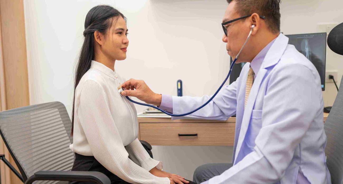 doctor-using-stethoscope-to-listen-heartbeat-of-el-2024-10-02-18-41-31-utc_11zon male doctor examining a female patient